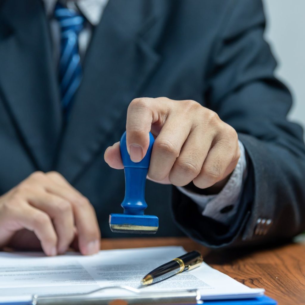 Man stamping approval-widen.com.au